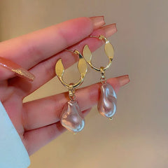 Angled view of the 14K Gold-Plated Irregular Pearl Earrings