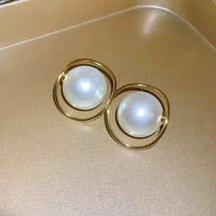 Angled view of the 14K Gold-Plated Large Pearl Earrings