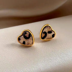 Close-up detail of the sparkling zircons and plating on the Leopard Heart Studs