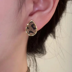 Close-up detail of the sparkling zircons and plating on the Leopard Drop Studs