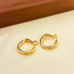 Angled view of the 14K Gold-Plated Letter Hoop Earrings