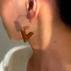 Model showcasing the dangle and style of the 14K Gold-Plated Light Luxury V-Shaped Earrings