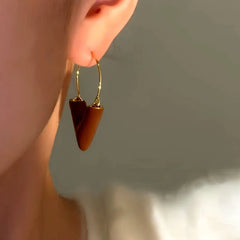 Close-up detail of the sparkling zircons and plating on the V-Shaped Dangles