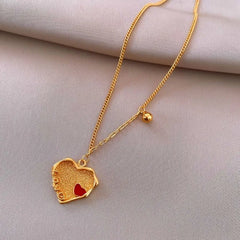 Close-up of the pendant and clasp on the Red Heart Necklace