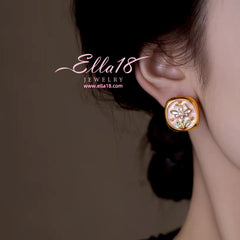 Close-up detail of the sparkling zircons and plating on the Baroque Pearl Studs