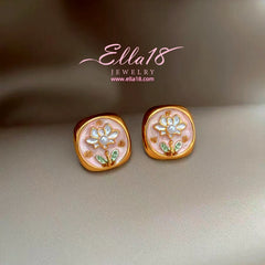 Model showcasing the dangle and style of the 14K Gold-Plated Luxury Baroque Pearl Stud Earrings