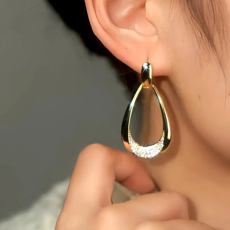 Model showcasing the dangle and style of the 14K Gold-Plated Luxury Big Water Drop Earrings