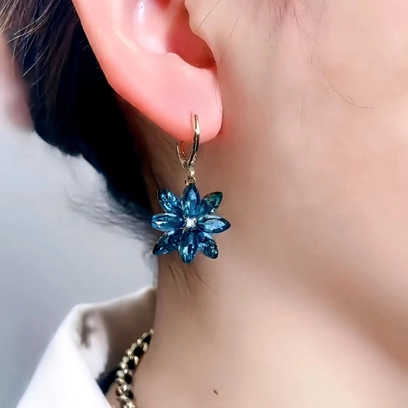 Close-up detail of the sparkling zircons and plating on the Blue Flower Earrings