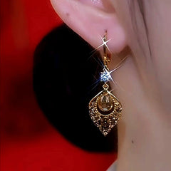 Close-up detail of the sparkling zircons and plating on the Diamond Knot Earrings