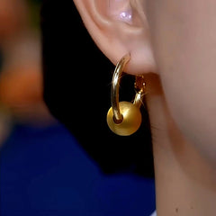 Close-up detail of the sparkling zircons and plating on the Brushed Ball Hoops
