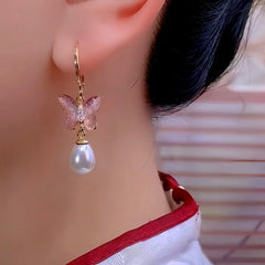 Close-up detail of the sparkling zircons and plating on the Pink Butterfly Tassel