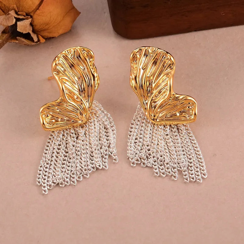 Model showcasing the dangle and style of the 14K Gold-Plated Luxury Butterfly Tassel Earrings