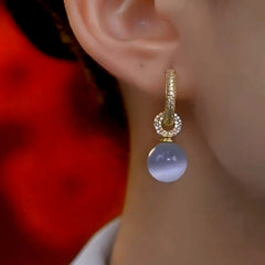 Close-up detail of the sparkling zircons and plating on the Cat's Eye Drops