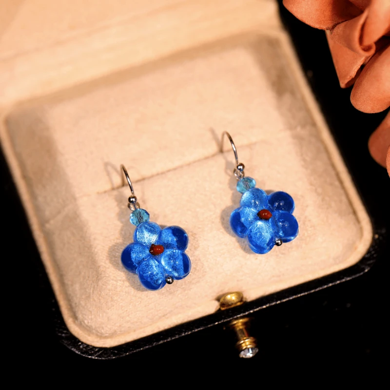 Angled view of the 14K Gold-Plated Luxury Cat's Eye Stone Blue Star Ear Hook Earrings