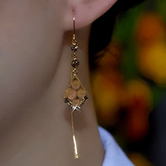 Close-up detail of the sparkling zircons and plating on the Cat's Eye Threaders