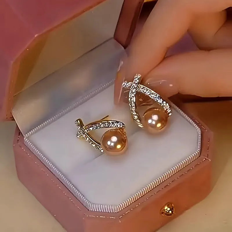 Close-up detail of the sparkling zircons and plating on the Pearl Dangle Earrings