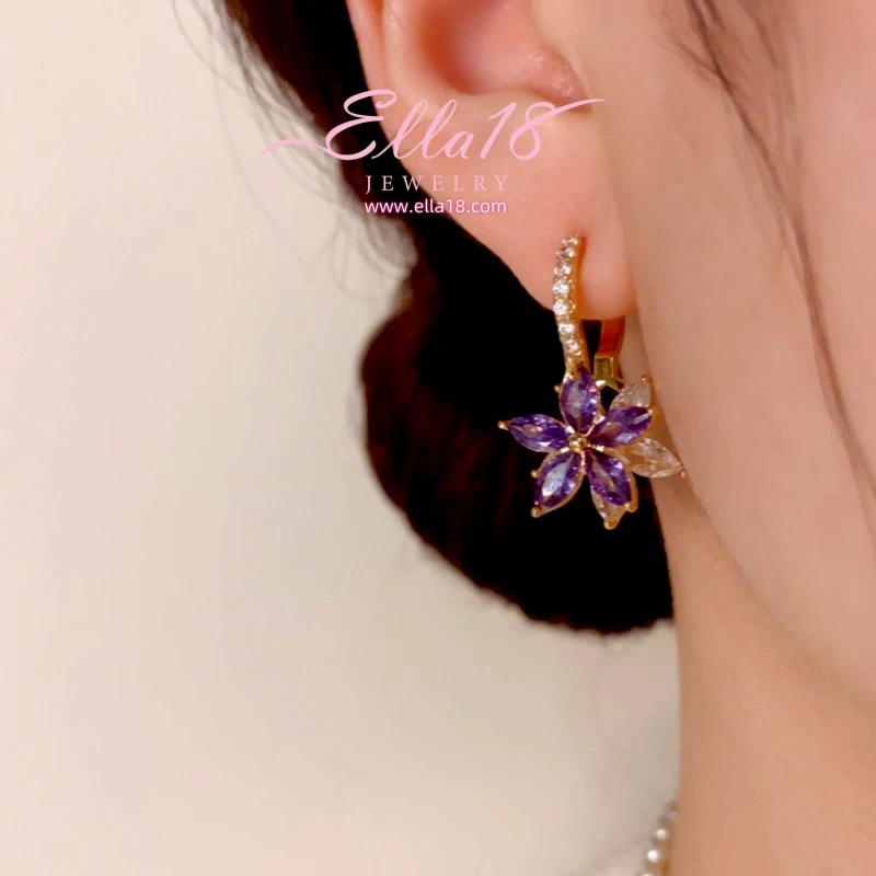 Close-up detail of the sparkling zircons and plating on the Purple Zircon Earrings