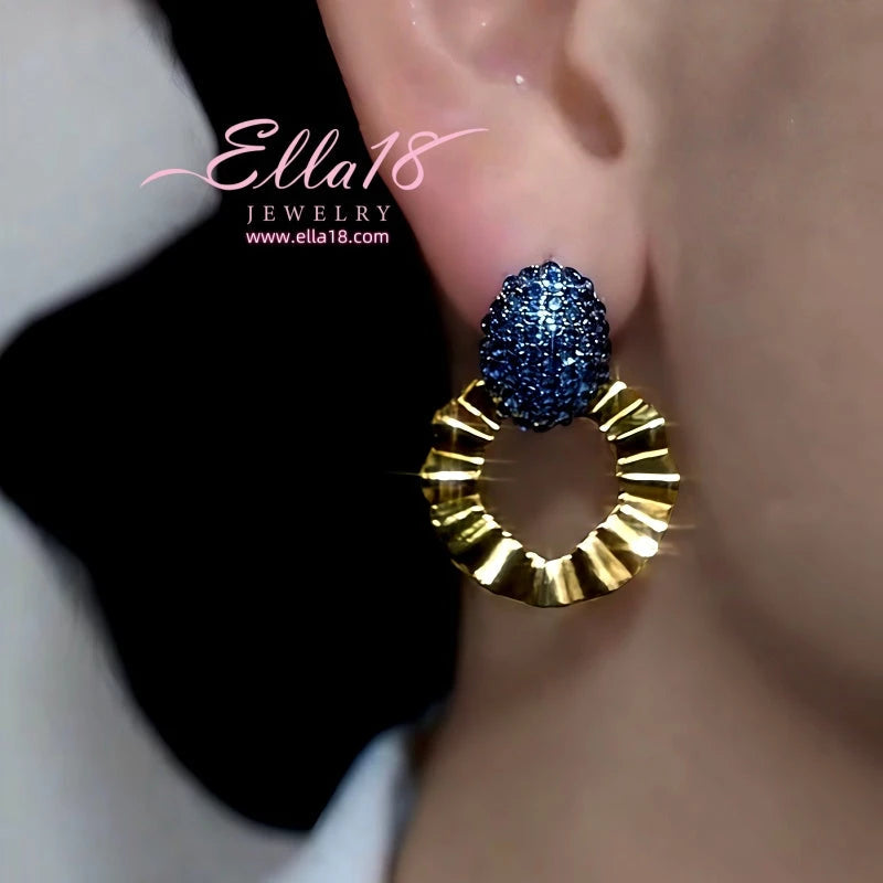 Model showcasing the dangle and style of the 14K Gold-Plated Luxury Design Zircon Diamond Earrings