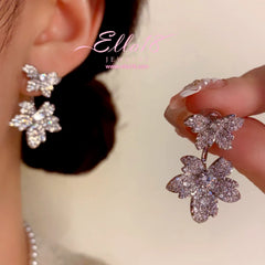 Close-up detail of the sparkling zircons and plating on the Maple Leaf Earrings