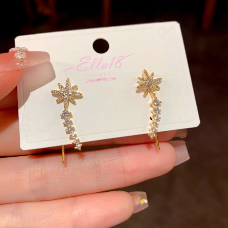 Close-up detail of the sparkling zircons and plating on the Star Crawler Earrings