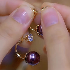 Close-up detail of the sparkling zircons and plating on the Double Pearl Earrings