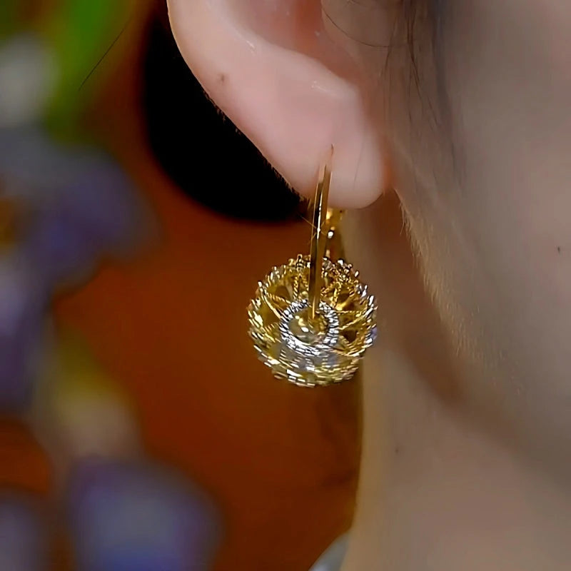 Model showcasing the dangle and style of the 14K Gold-Plated Luxury Diamond Hollow Crystal Earrings