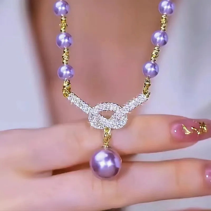 Close-up of the pendant and clasp on the Purple Pearl Necklace