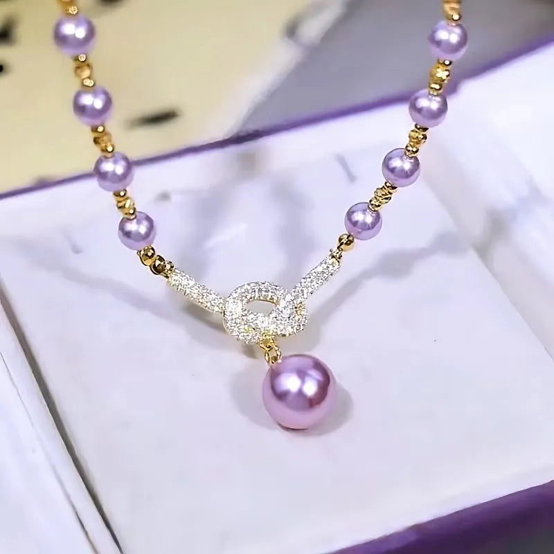 Detailed view of the 14K Gold-Plated Luxury Diamond Purple Pearl Necklace chain and pendant