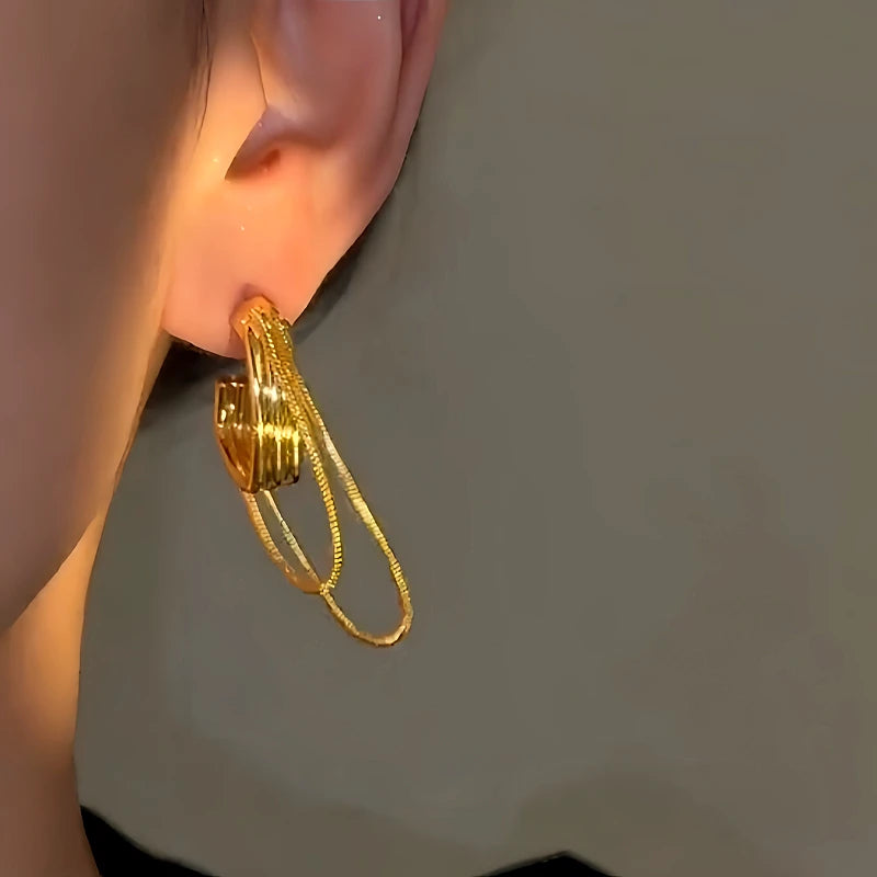 Close-up detail of the sparkling zircons and plating on the Chain Tassel Earrings