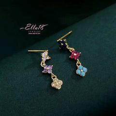 Close-up detail of the sparkling zircons and plating on the Clover Tassel Earrings