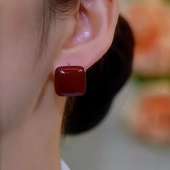 Close-up detail of the sparkling zircons and plating on the Red Glaze Studs