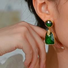 Close-up detail of the sparkling zircons and plating on the Green Tassel Earrings