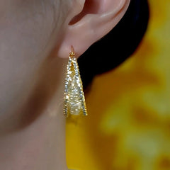 Close-up detail of the sparkling zircons and plating on the Hollow Hoop Earrings