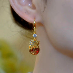 Close-up detail of the sparkling zircons and plating on the Lucky Bag Earrings
