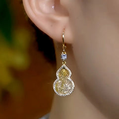 Close-up detail of the sparkling zircons and plating on the Mesh Gourd Earrings