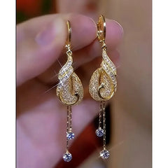 Close-up detail of the sparkling zircons and plating on the Phoenix Tassel Earrings