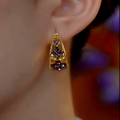 Model showcasing the dangle and style of the 14K Gold-Plated Luxury Purple Full Diamond Geometric Earrings