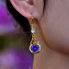 Close-up detail of the sparkling zircons and plating on the Purple Water Drop