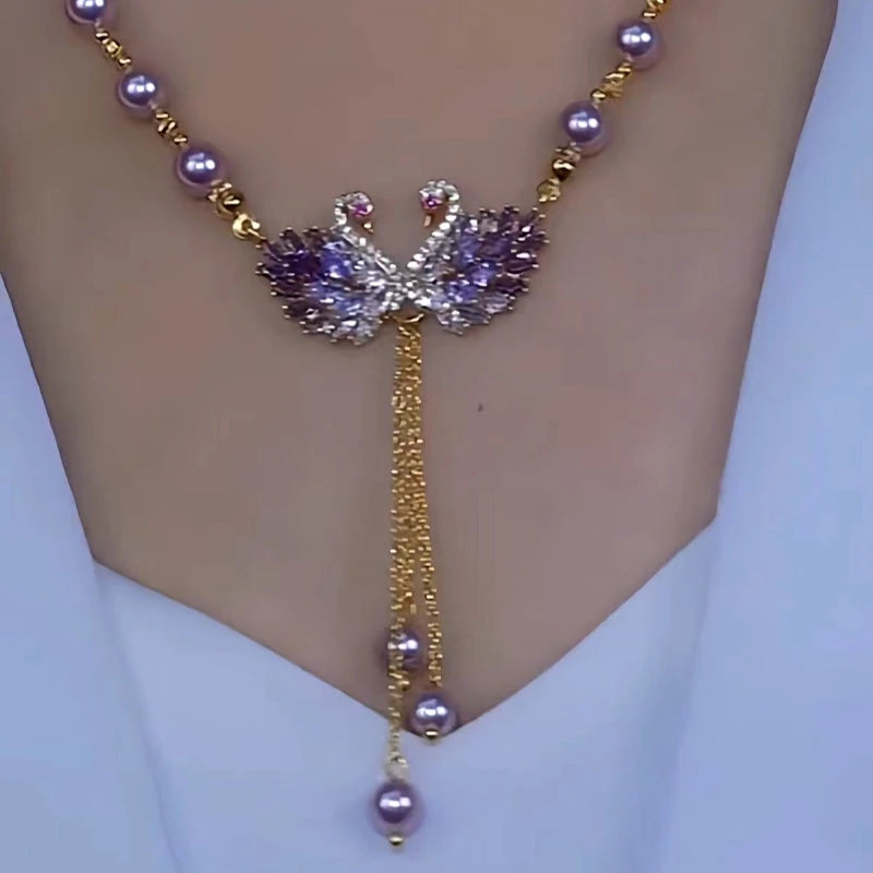 Detailed view of the 14K Gold-Plated Luxury Swan Pearl Necklace chain and pendant