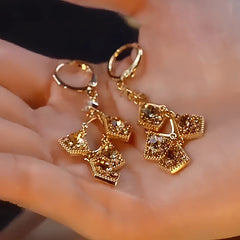 Angled view of the 14K Gold-Plated Luxury Three-Dimensional Crystal Diamond Geometric Earrings
