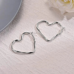 Angled view of the 14K Gold-Plated Luxury Twisted Irregular Big Heart Earrings