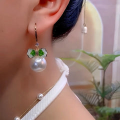 Close-up detail of the sparkling zircons and plating on the Bow Pearl Ear Hooks