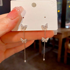 Angled view of the 14K Gold-Plated Luxury Zircon Butterfly Tassel Earrings