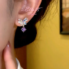 Model showcasing the dangle and style of the 14K Gold-Plated Luxury Zircon Diamond Butterfly Earrings