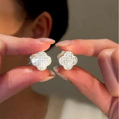 Angled view of the 14K Gold-Plated Luxury Zircon Diamond Four-Leaf Flower Earrings