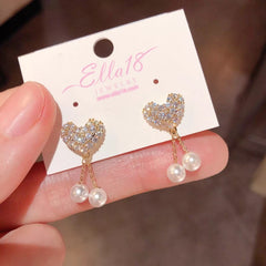 Close-up detail of the sparkling zircons and plating on the Heart Pearl Tassel