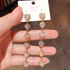Close-up detail of the sparkling zircons and plating on the Heart Tassel Earrings