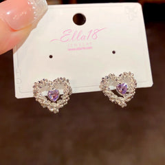 Angled view of the 14K Gold-Plated Luxury Zircon Diamond Hollow Heart Stud Earrings