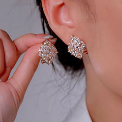 Model showcasing the dangle and style of the 14K Gold-Plated Luxury Zircon Diamond Square Stud Earrings