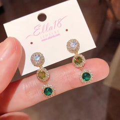 Model showcasing the dangle and style of the 14K Gold-Plated Luxury Zircon Diamond Tassel Earrings